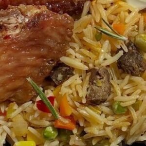 Jollof rice with fried turkey and mix garden salad