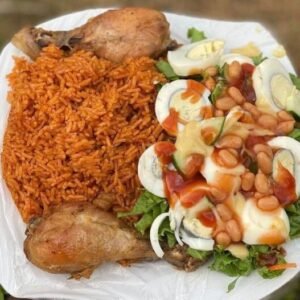 Jollof rice with chicken and mix garden salad