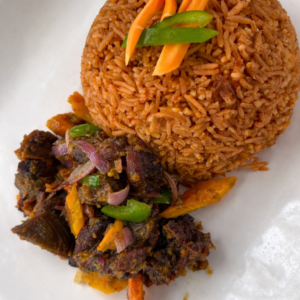 Jollof rice with fried beef and mix garden salad
